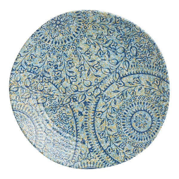 A blue and yellow plate with a circular design and leaves in the center.