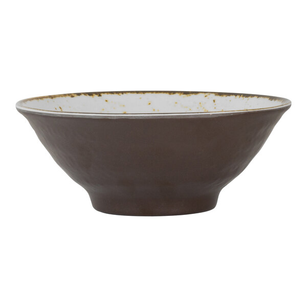 A brown and white bowl with a gold rim.