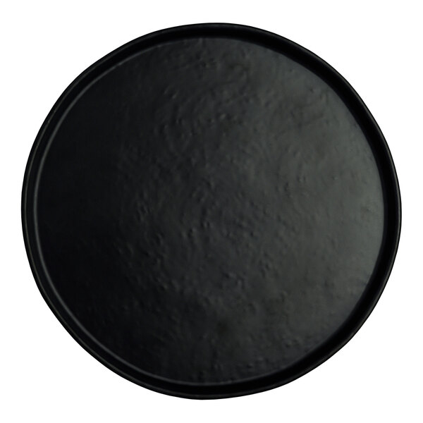 A close up of a black round Creations Cali melamine plate.