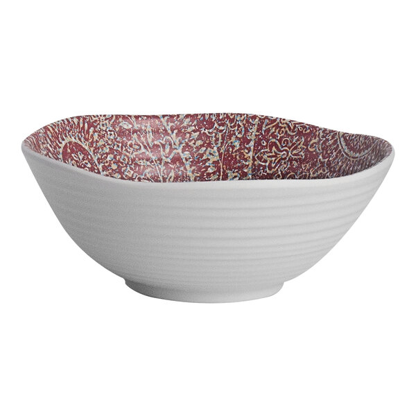 A white Steelite Solano melamine bowl with red and blue patterned surface.