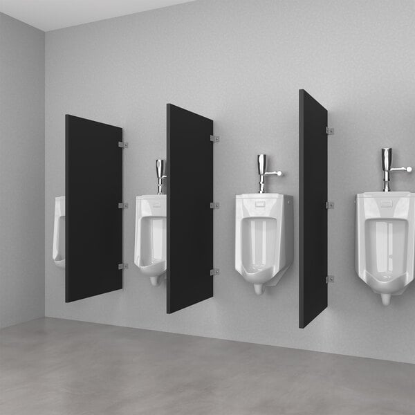 A row of black Hadrian urinal partitions in a bathroom.