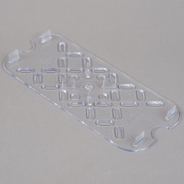 A clear plastic Vollrath Super Pan drain tray with holes.