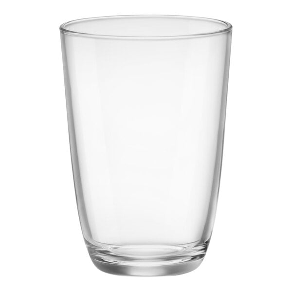 A Bormioli Rocco long drink glass filled with a clear liquid and a straw.