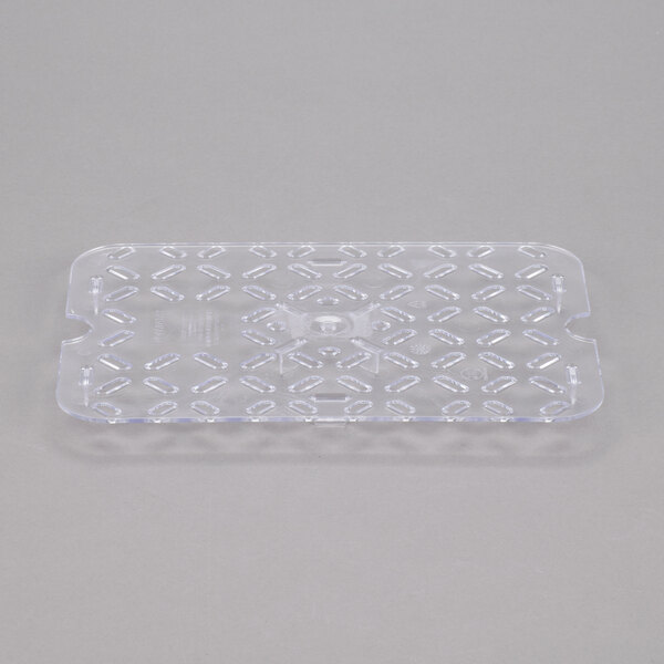 A clear plastic Vollrath Super Pan drain tray with holes.