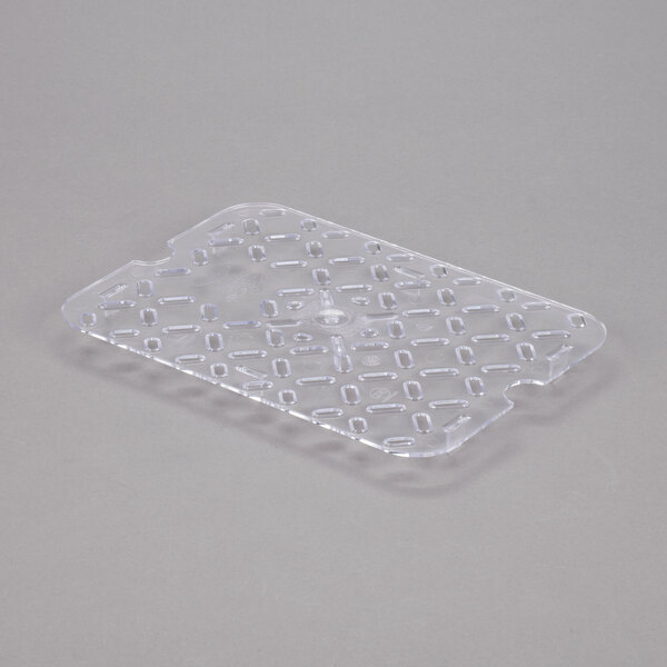 A clear plastic Vollrath 1/2 size drain tray with holes.