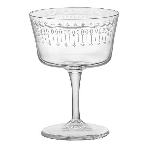 A clear Bormioli Rocco Fizz cocktail glass with a design on it.