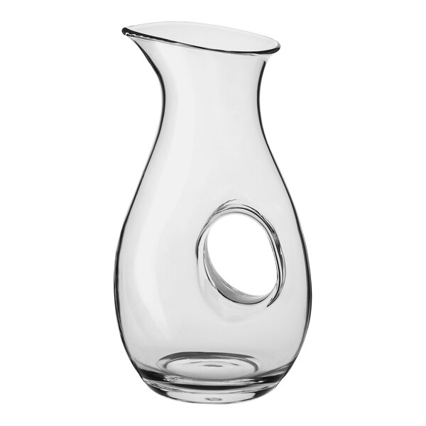A clear glass wine decanter with a hole in the bottom.