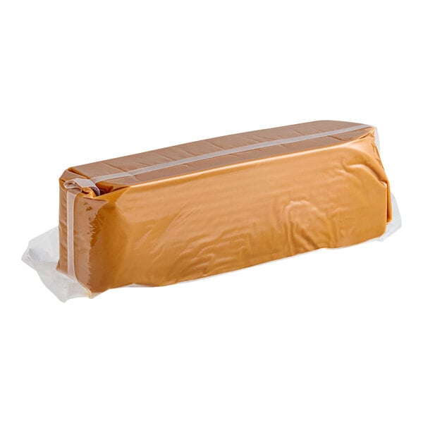 A brown package of Peter's Chocolate Caramel Loaf wrapped in plastic.