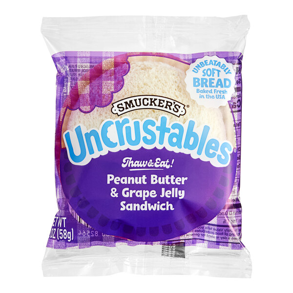 A package of Smucker's Uncrustables grape jelly and peanut butter sandwiches on a white background.