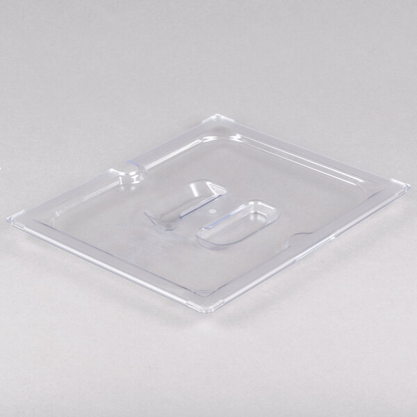A clear plastic container with a clear plastic slotted lid.