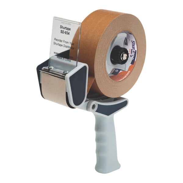 A Shurtape Professional pistol-grip tape dispenser with a roll of tape on it.