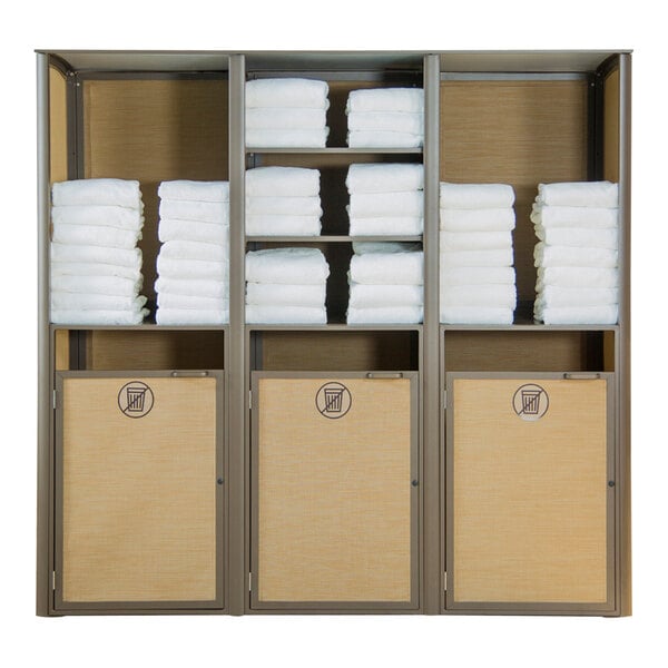 A Grosfillex Sunset Cognac and Bronze towel valet with towels stacked on shelves.