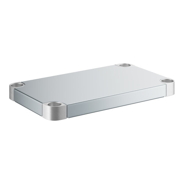 A white rectangular object with a silver metal frame.