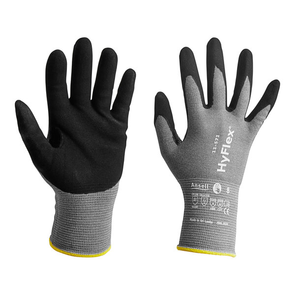A black Ansell  glove with a yellow knit wrist and black palm.