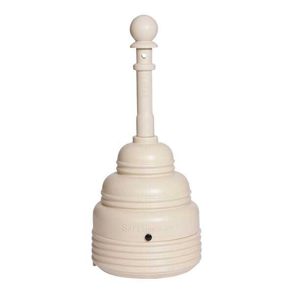 A beige cylindrical object with a lid on top.