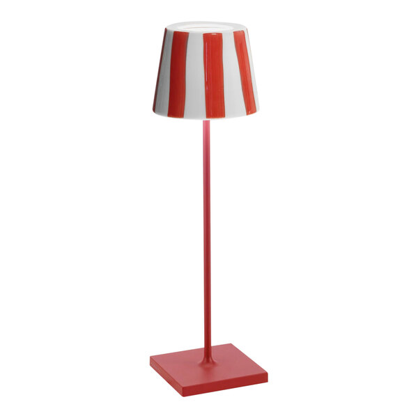 A red and white striped Zafferano America Poldina Pro Lido table lamp.