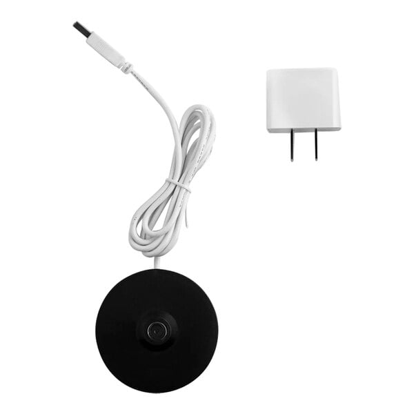 A white Zafferano America charging base with a white plug and cable.