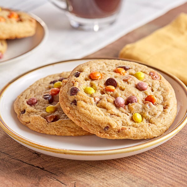 Two preformed peanut butter and chocolate David's Cookies on a plate.