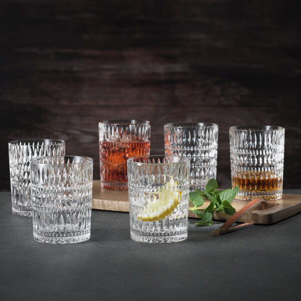 A Nachtmann Rocks glass with a slice of lemon in it.