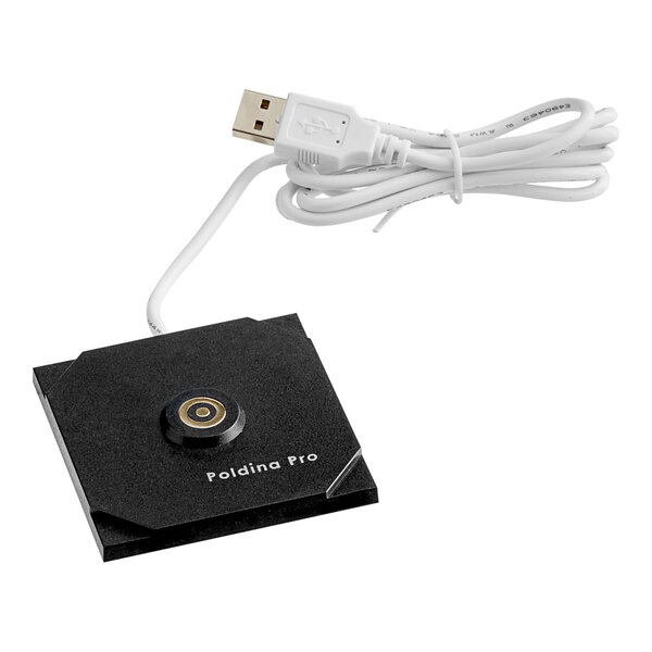A black square USB charging device with a white cord plugged in.