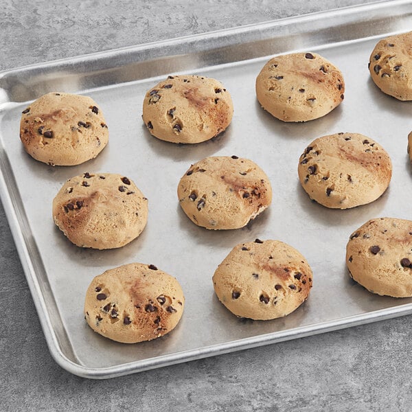 Preformed David's Cookies chocolate chip cookie dough on a baking tray.