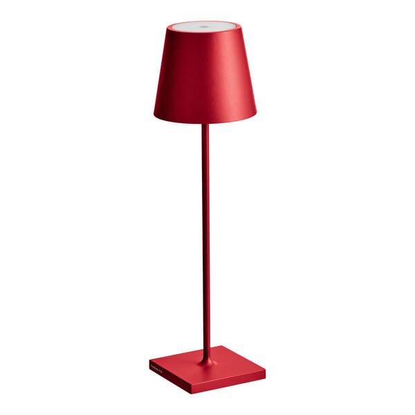 A Zafferano America Poldina Pro red table lamp on a stand with a shade.