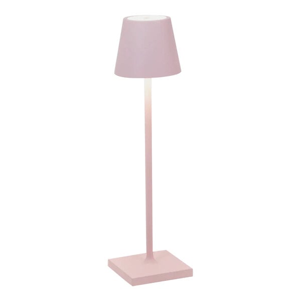 A Zafferano America Poldina Pro pink table lamp with a white stand and shade.