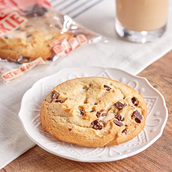 An Otis Spunkmeyer frozen chocolate chunk cookie on a plate.