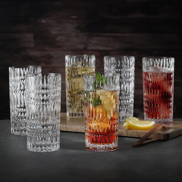 A close-up of a Nachtmann long drink glass filled with a colored liquid.