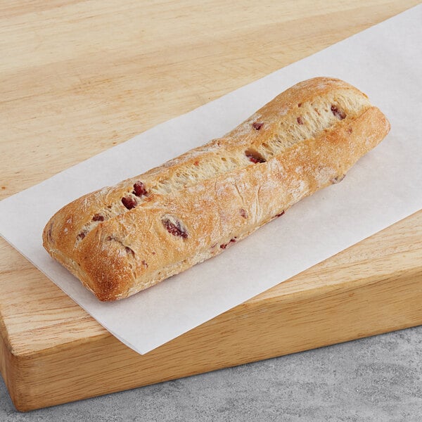 A case of Bridor Cranberry Baguettines on a white paper.