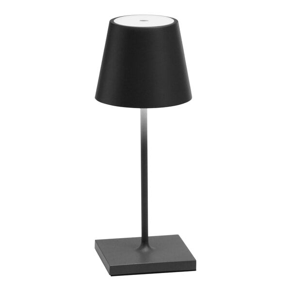 A dark gray Zafferano America Poldina Pro Mini cordless table lamp on a stand.