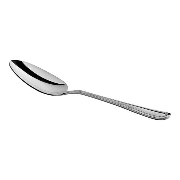A Choice Milton stainless steel serving spoon with a silver handle.