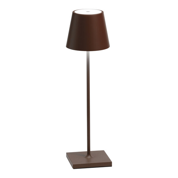 A rust-colored cordless rechargeable table lamp with a conical shade and square base.
