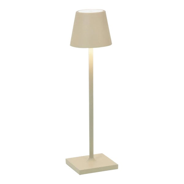 A white lamp with a sand shade on a white square base and a white pole