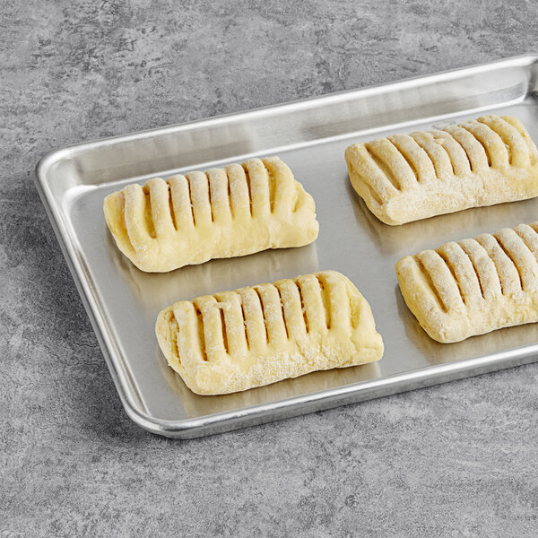 Bridor ready-to-bake key lime cheesecake danishes on a baking sheet.