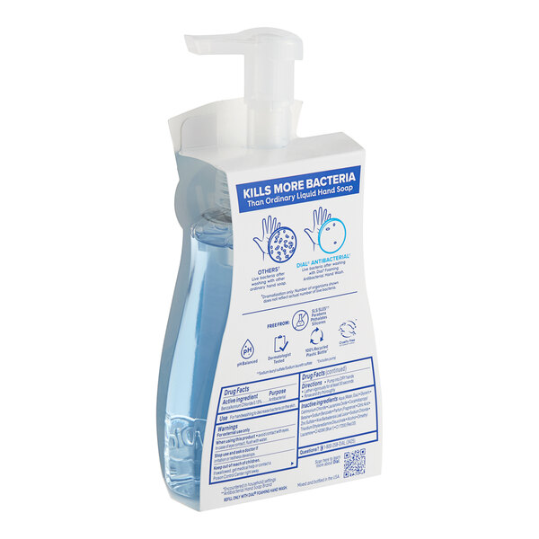 A bottle of Dial Spring Water foaming hand soap with a pump on a white background.