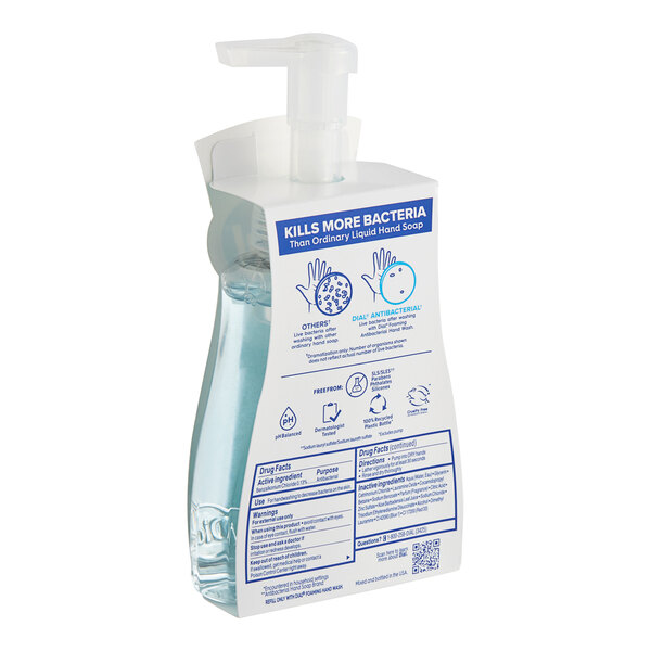 A plastic bottle of Dial Coconut Water Foaming Hand Soap with a blue and white label and a pump.