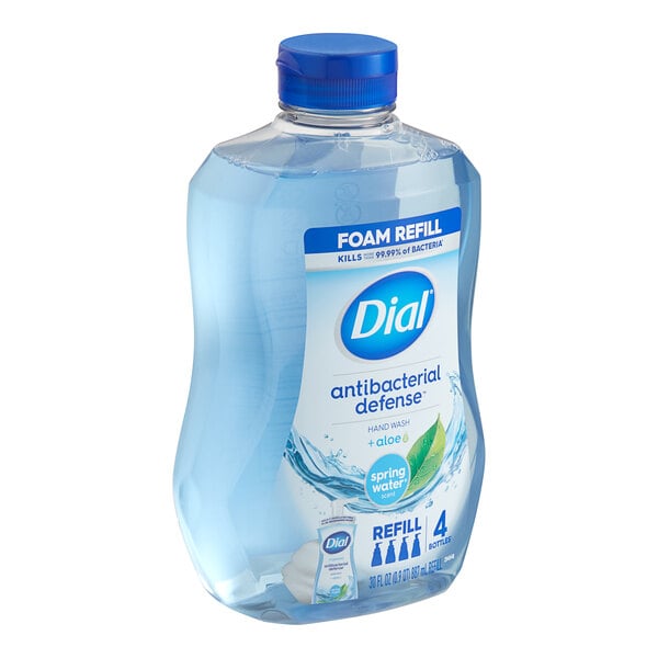 A Dial bottle of Dial Spring Water hand wash liquid with a blue cap.