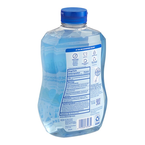 A plastic bottle of Dial Spring Water foaming hand soap with a blue label and cap.