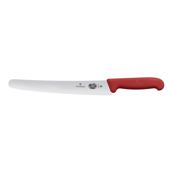 A Victorinox bread knife with a red handle.