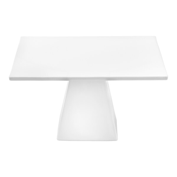 A white square porcelain display stand on a white table.