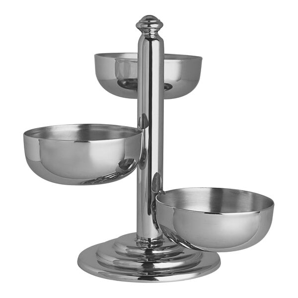 A three-tier stainless steel condiment holder on a stand.
