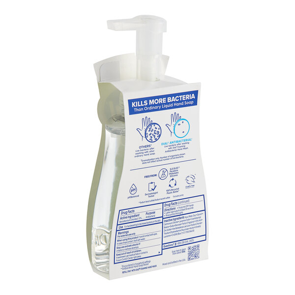A plastic bottle of Dial White Tea Foaming Hand Soap with a pump.