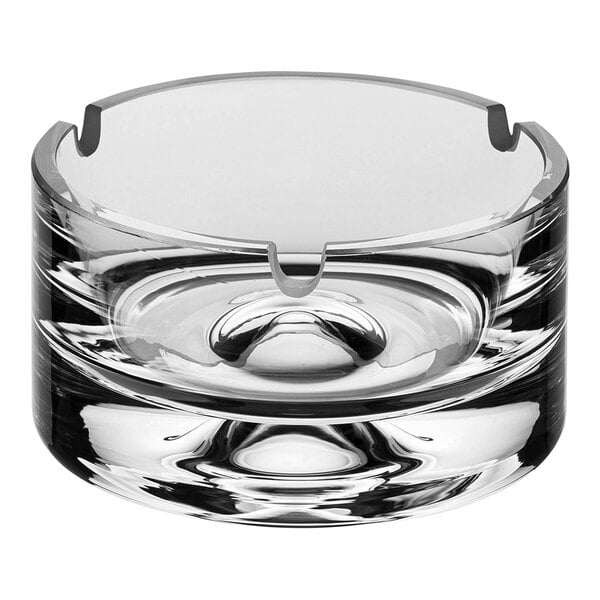 A Nude Fumo crystal glass ashtray with a circular design.