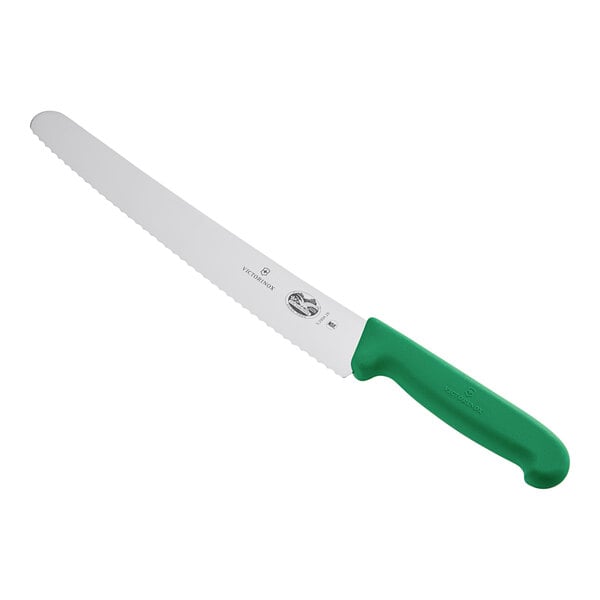 A Victorinox bread knife with a green handle.