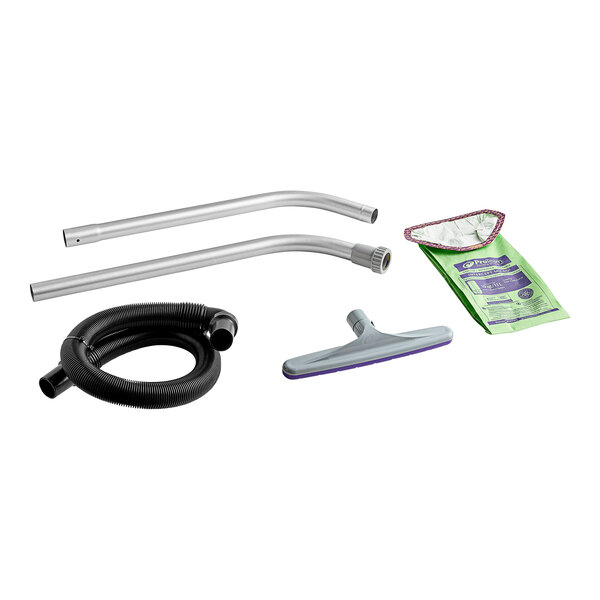 A ProTeam GoFit 10 backpack vacuum with hose and cleaning accessories on a kitchen counter.