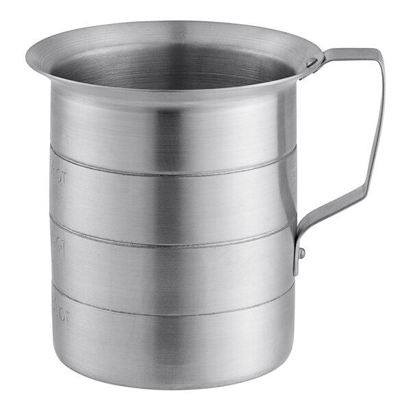 A silver aluminum measuring cup with a handle.