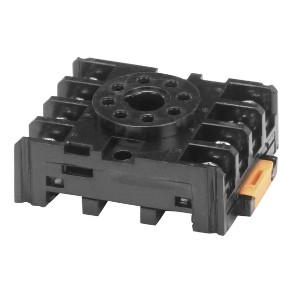 A black plastic square Stero socket with holes.