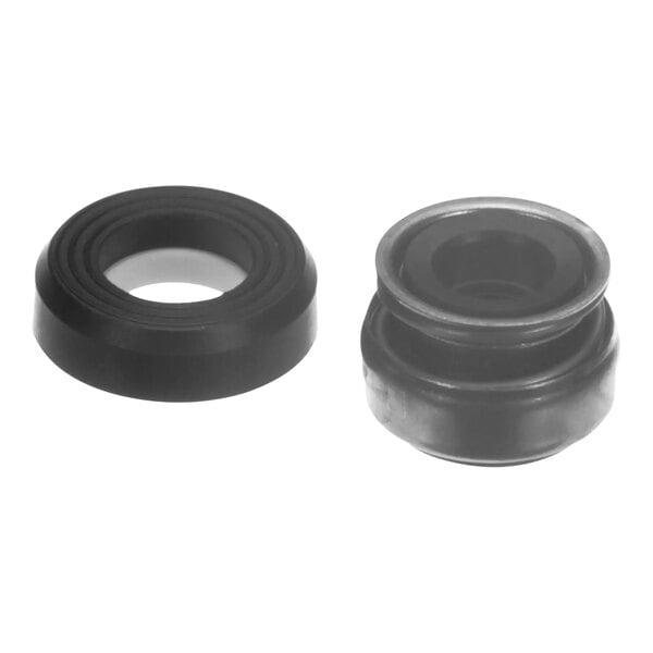 A black rubber round seal with a silver center.