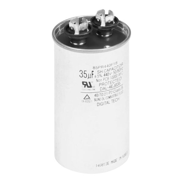 A white Follett Corporation run capacitor with black text.